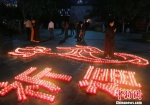 除夕夜的祈福活动吸引了众多游客信众 王晓斌 摄 - 中新网海南频道