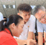 图为5月17日，省长沈晓明来到省残疾人创业就业一条街，向正在工作的残疾人问好，关切地询问他们的工作生活情况。 - 残疾人联合会