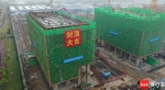 首栋主体建筑封顶 海口江东新区南渡江东岸小学项目按下快进键 - 海南新闻中心